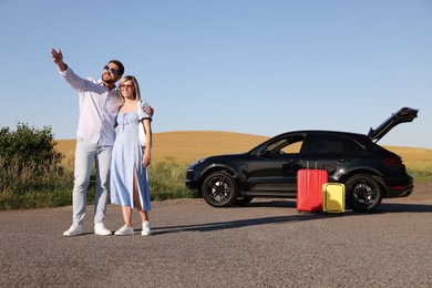 Couple, car and suitcases outdoors. Family traveling