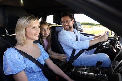 Happy family enjoying trip together by car, view from outside