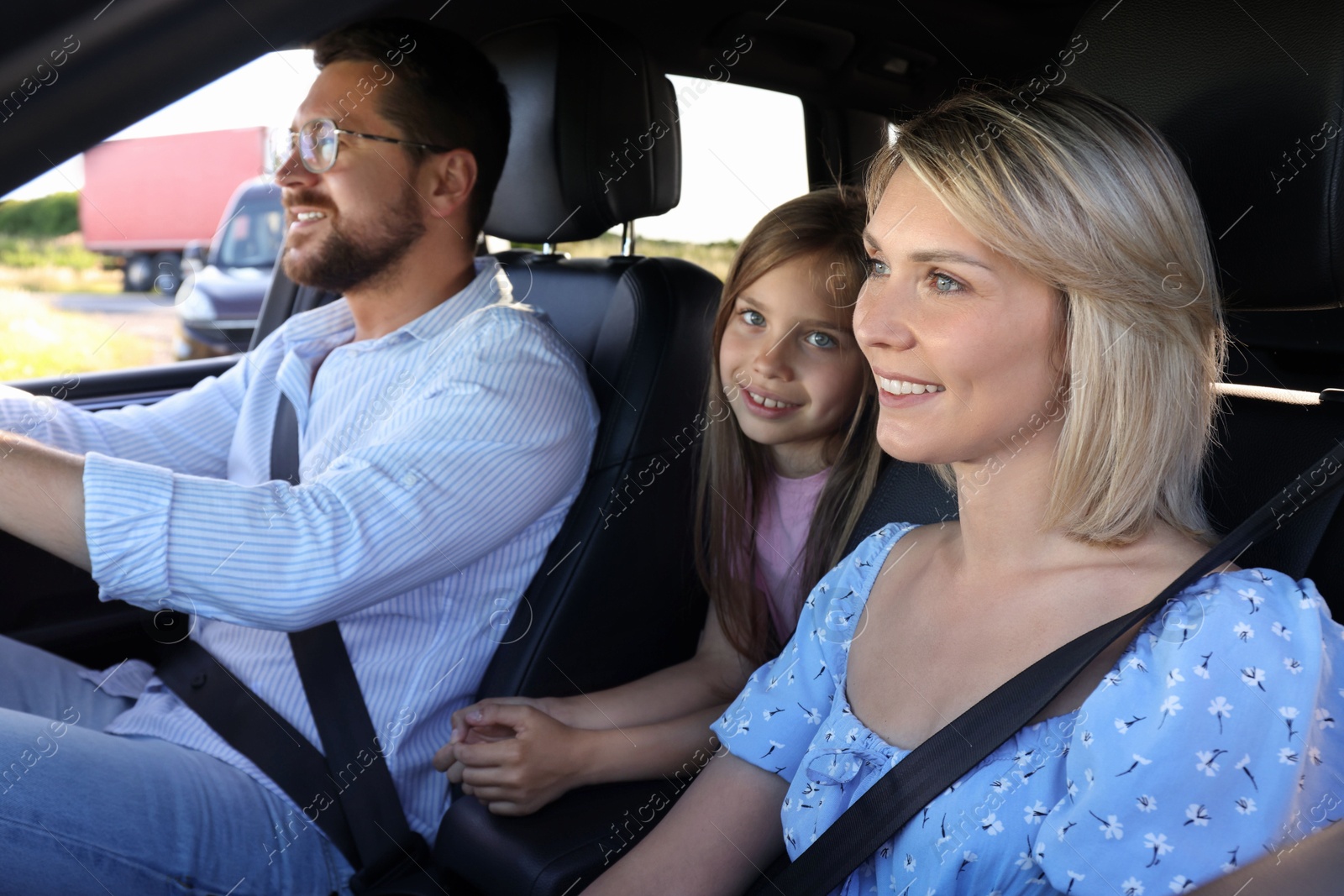 Photo of Happy family enjoying trip together by car, view from outside