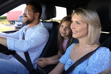 Happy family enjoying trip together by car, view from outside