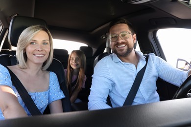 Happy family enjoying trip together by car, view from inside