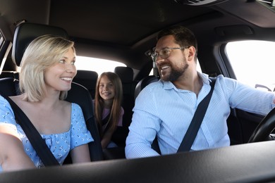 Photo of Happy family enjoying trip together by car, view from inside