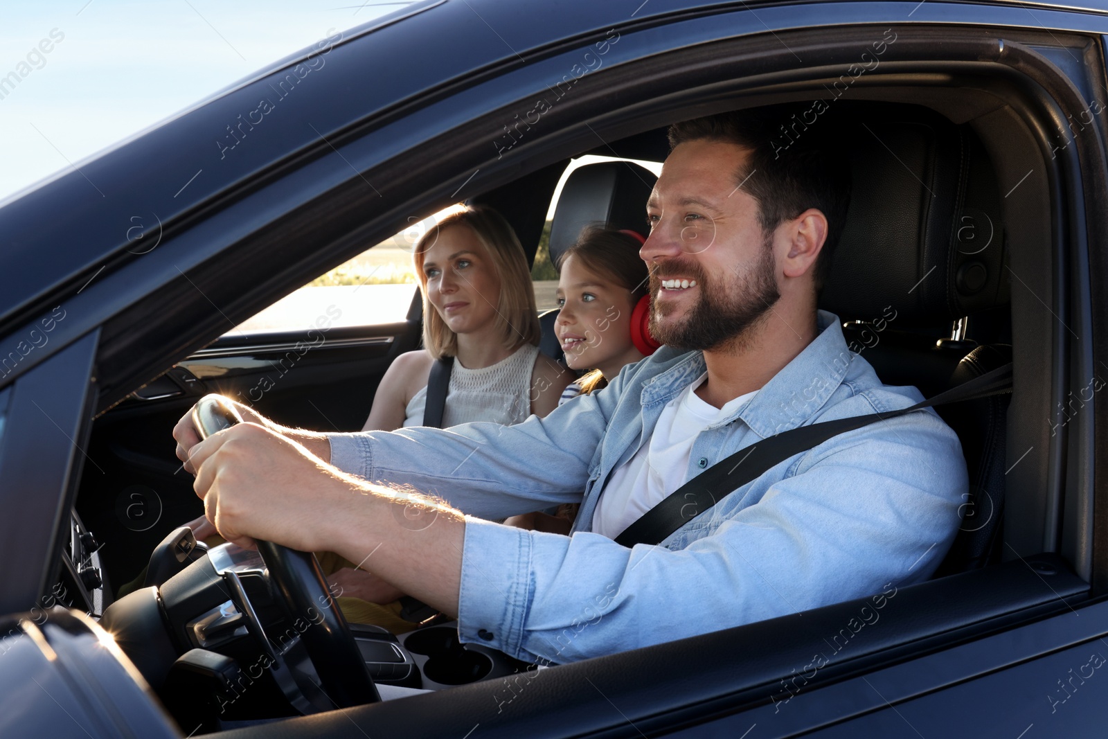 Photo of Happy family enjoying trip together by car, view from outside