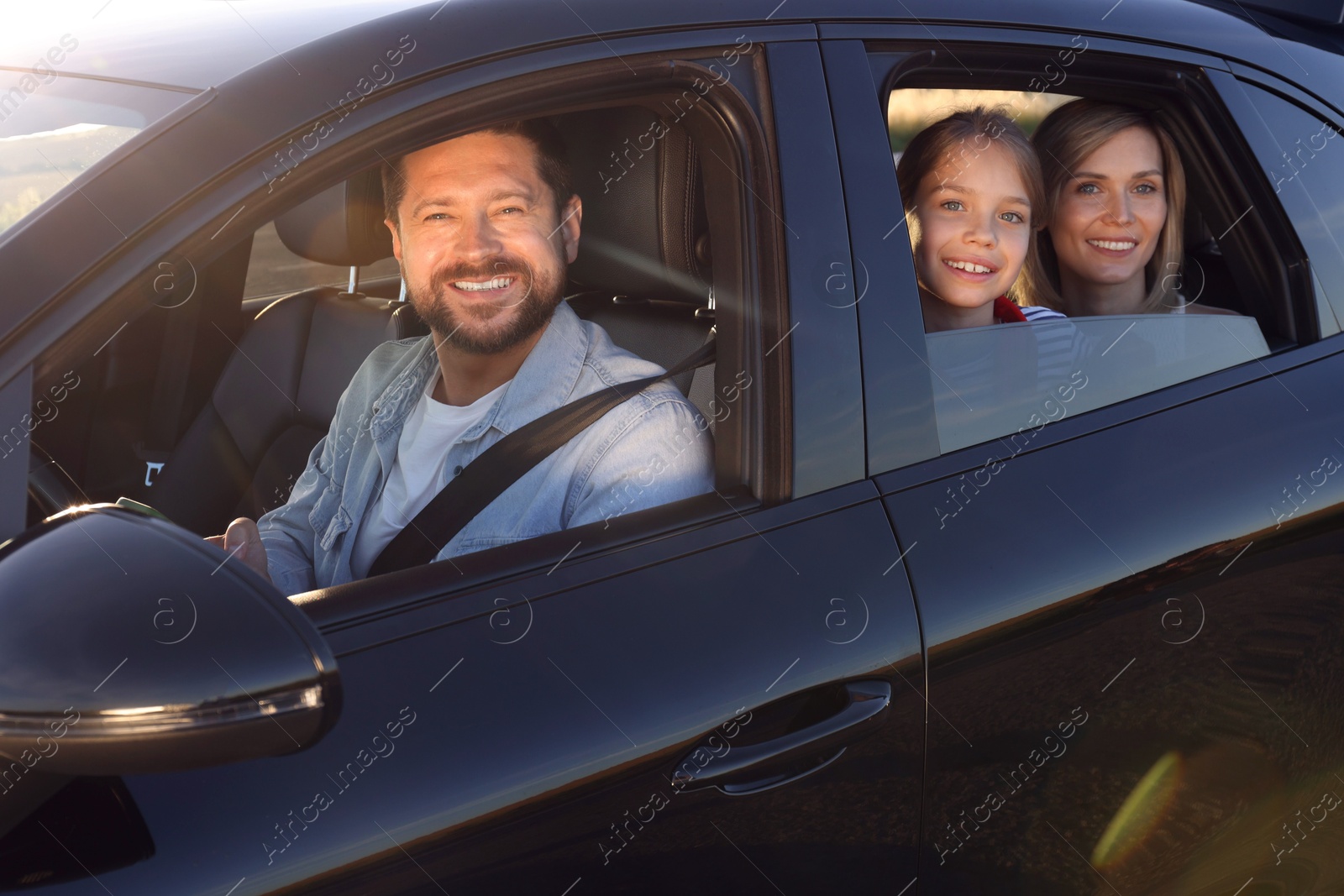 Photo of Happy family enjoying trip together by car, view from outside