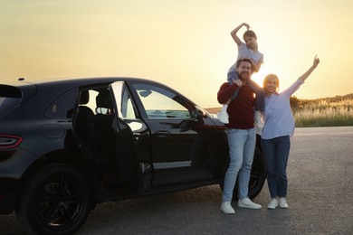 Happy parents and their daughter near car outdoors