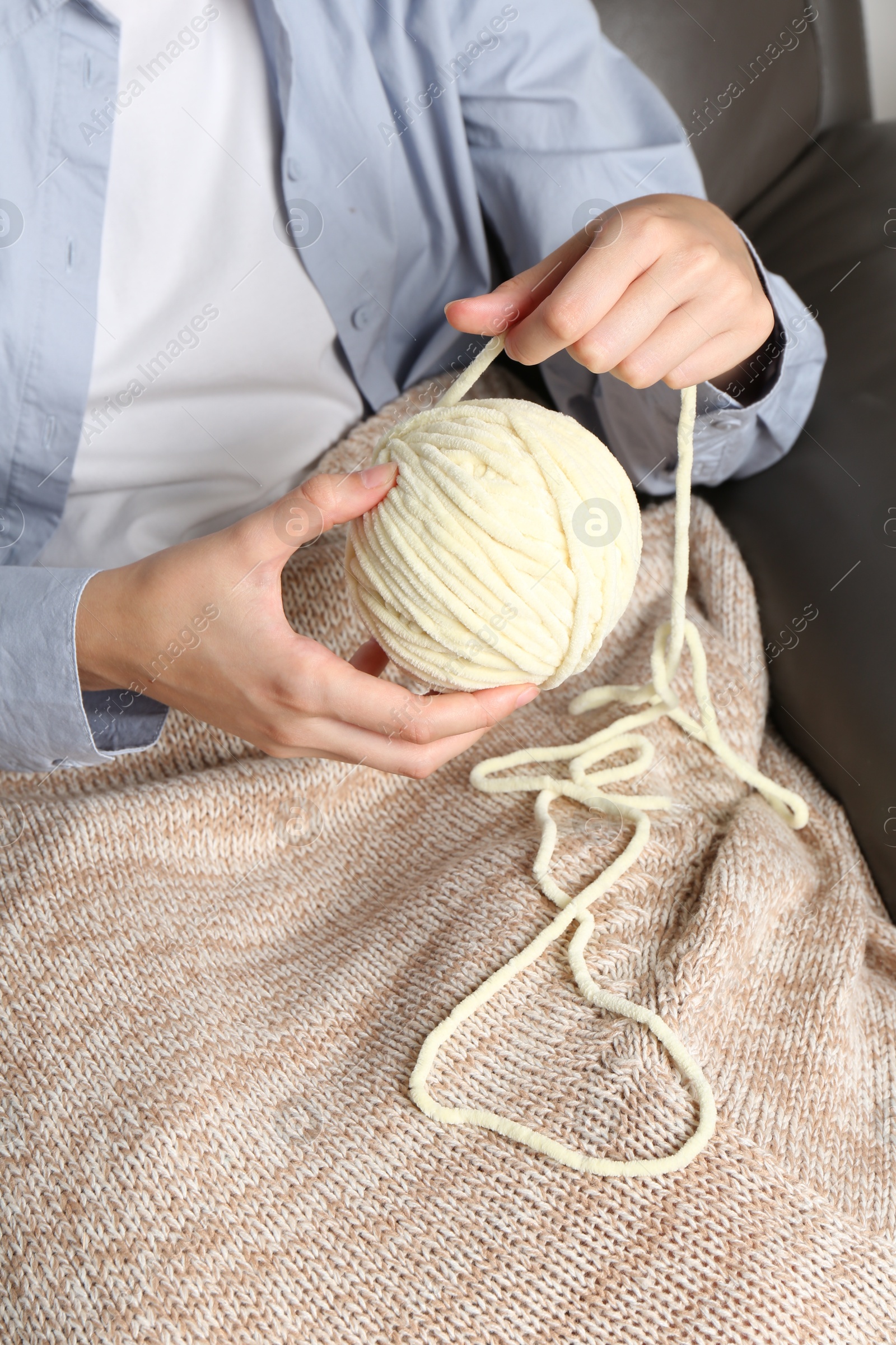 Photo of Woman holding ball of yarn, closeup view