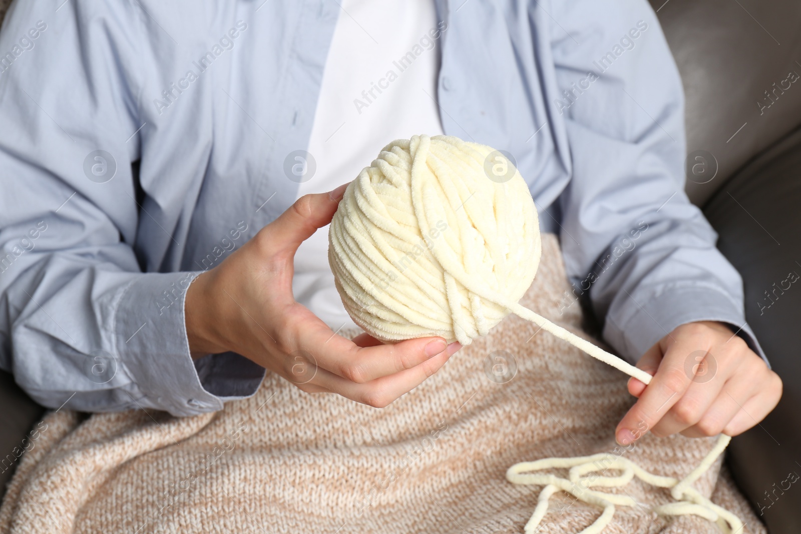 Photo of Woman holding ball of yarn, closeup view