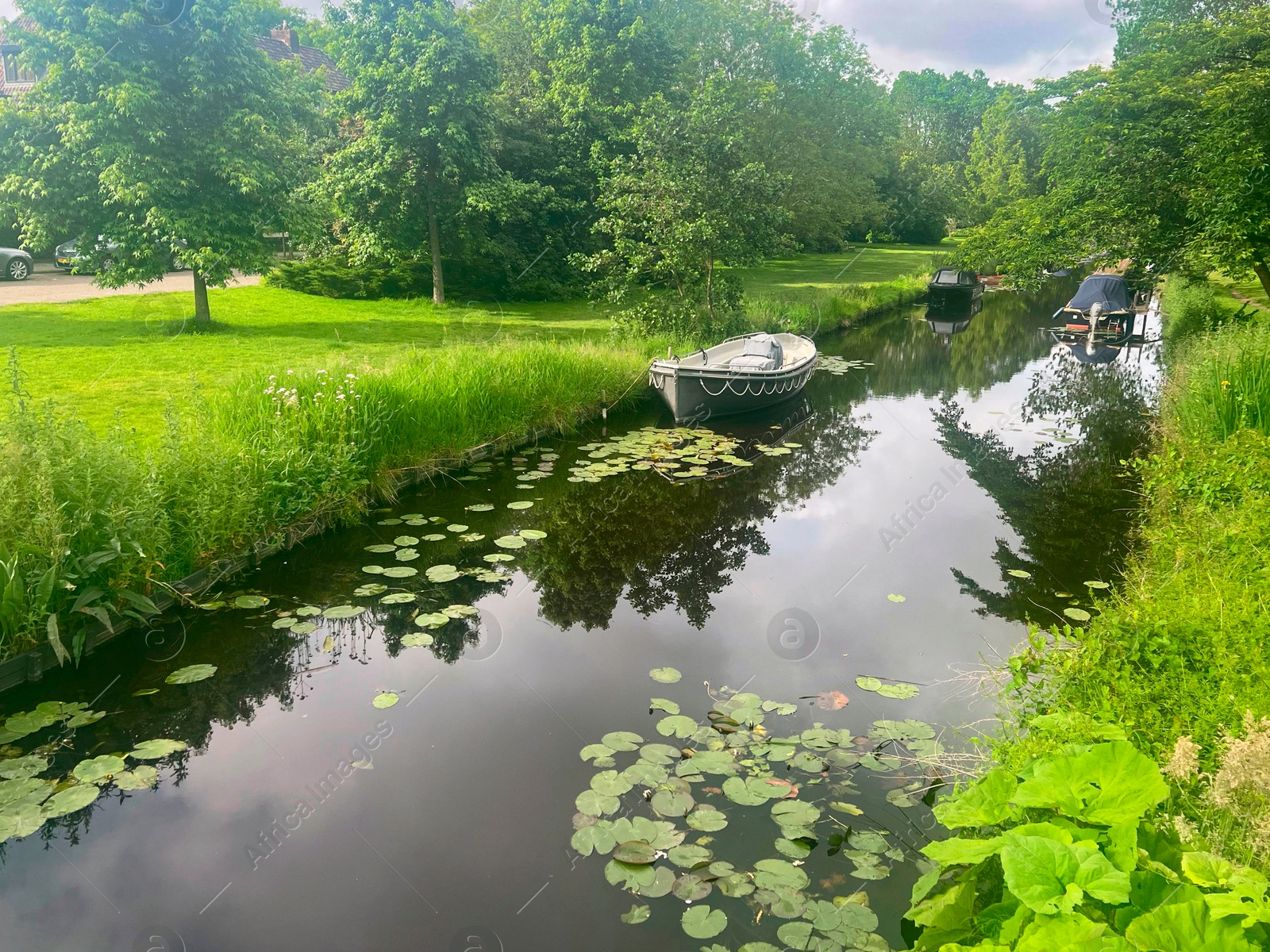 Photo of Picturesque view of canal with moored boats