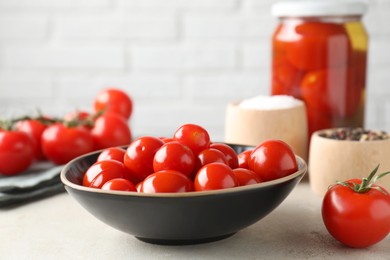 Photo of Tasty pickled tomatoes, fresh vegetables and spices on light grey table