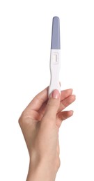 Photo of Woman holding pregnancy test on white background, closeup