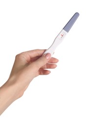 Woman holding pregnancy test on white background, closeup