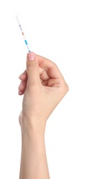 Photo of Woman holding pregnancy test on white background, closeup