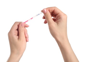 Photo of Woman holding pregnancy test on white background, closeup