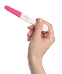 Woman holding pregnancy test on white background, closeup