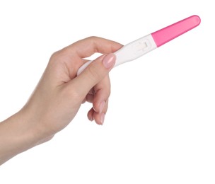 Woman holding pregnancy test on white background, closeup