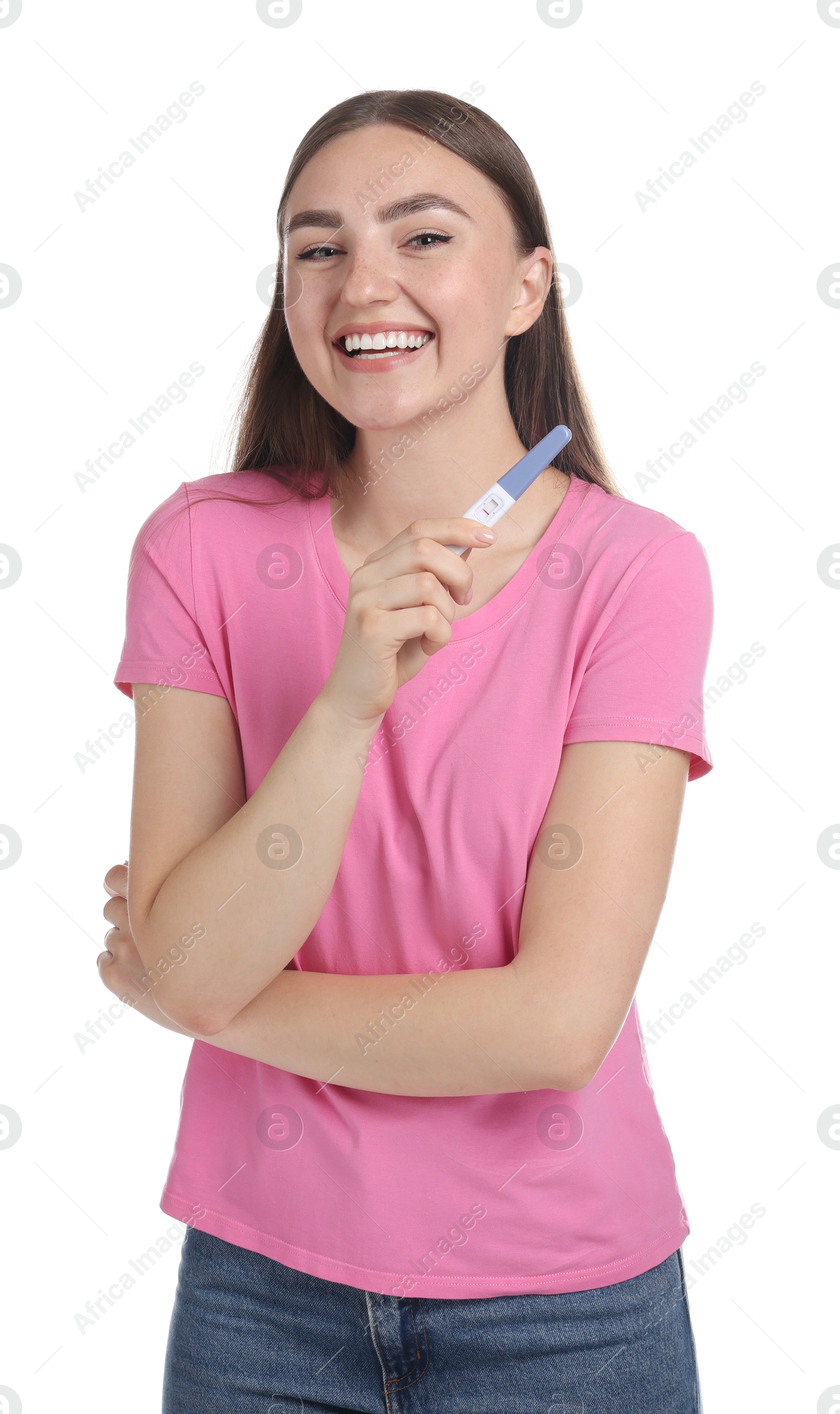 Photo of Happy woman holding pregnancy test on white background