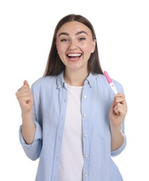 Happy woman holding pregnancy test on white background