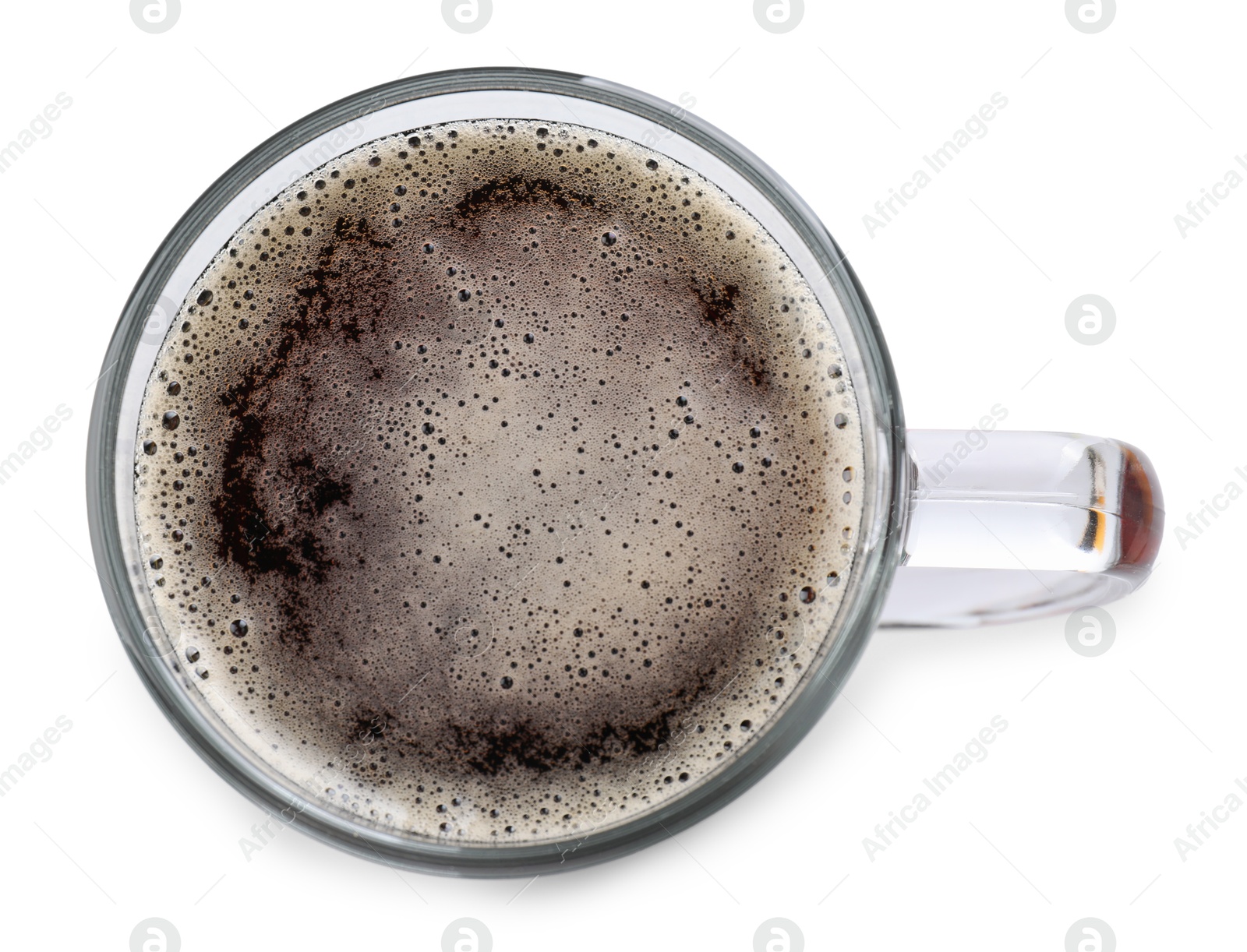 Photo of Glass mug of dark beer isolated on white, top view