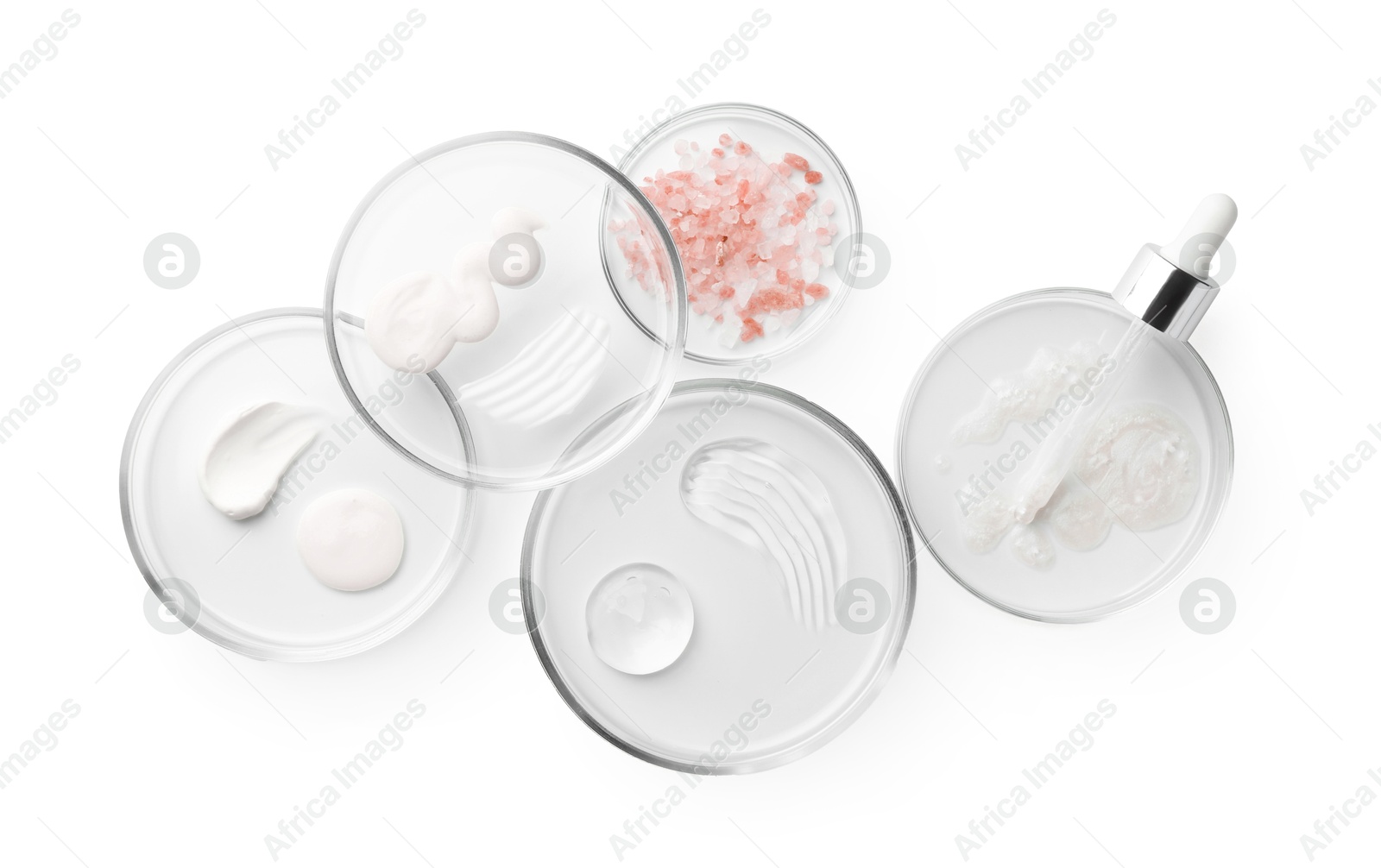 Photo of Petri dishes with different cosmetic products and leaves isolated on white, flat lay