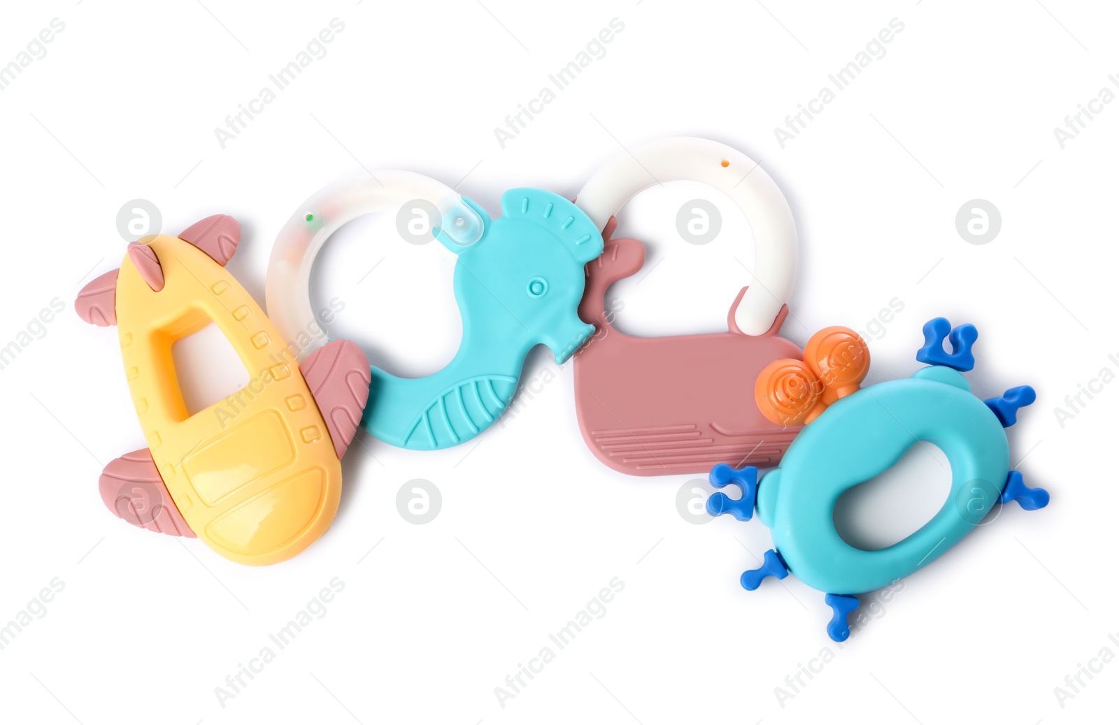 Photo of Colorful rattles isolated on white, top view. Baby accessories