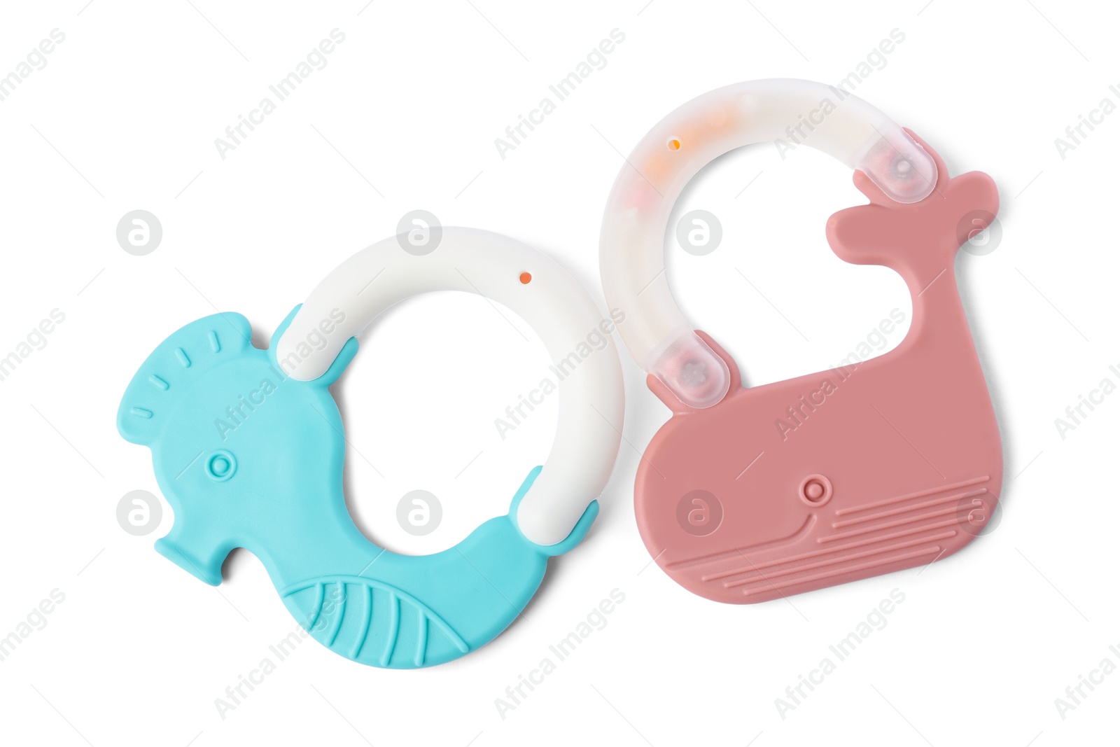 Photo of Colorful rattles isolated on white, top view. Baby accessories