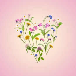 Image of Heart made of meadow flowers on pink gradient background