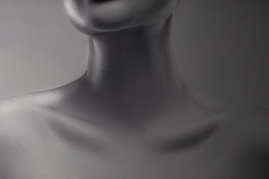 Image of Gorgeous woman showing her beautiful neck, closeup. Black and white effect