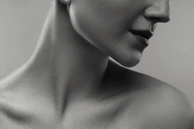 Image of Gorgeous woman showing her beautiful neck, closeup. Black and white effect