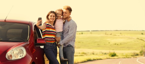 Image of Happy family taking selfie near car on road trip. Banner design