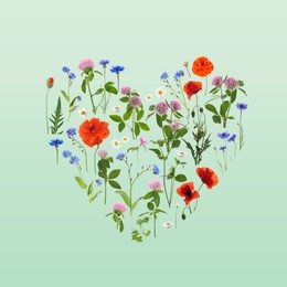 Heart made of meadow flowers on aquamarine gradient background