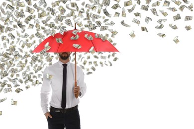 Businessman with umbrella under money rain on white background