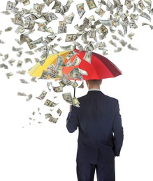 Businessman with umbrella under money rain on white background