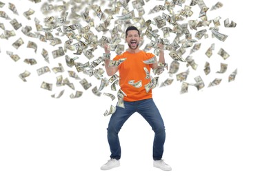 Image of Happy man under money rain on white background