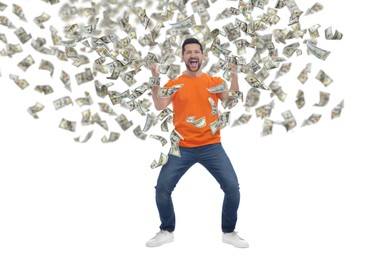 Happy man under money rain on white background