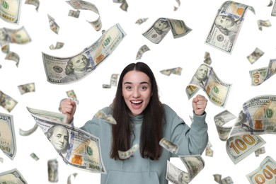 Happy woman under money rain on white background