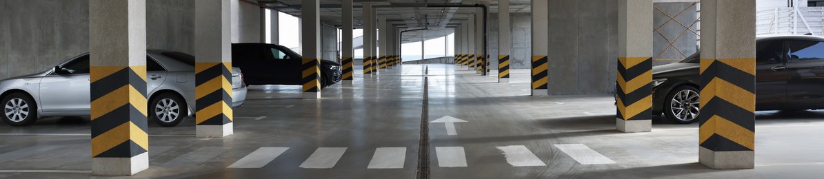 Modern parking garage with cars, banner design