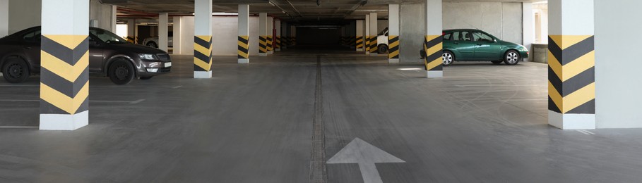 Open parking garage with cars, banner design