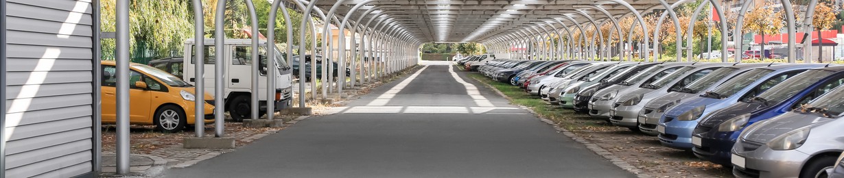 Parking with cars on autumn day outdoors, banner design