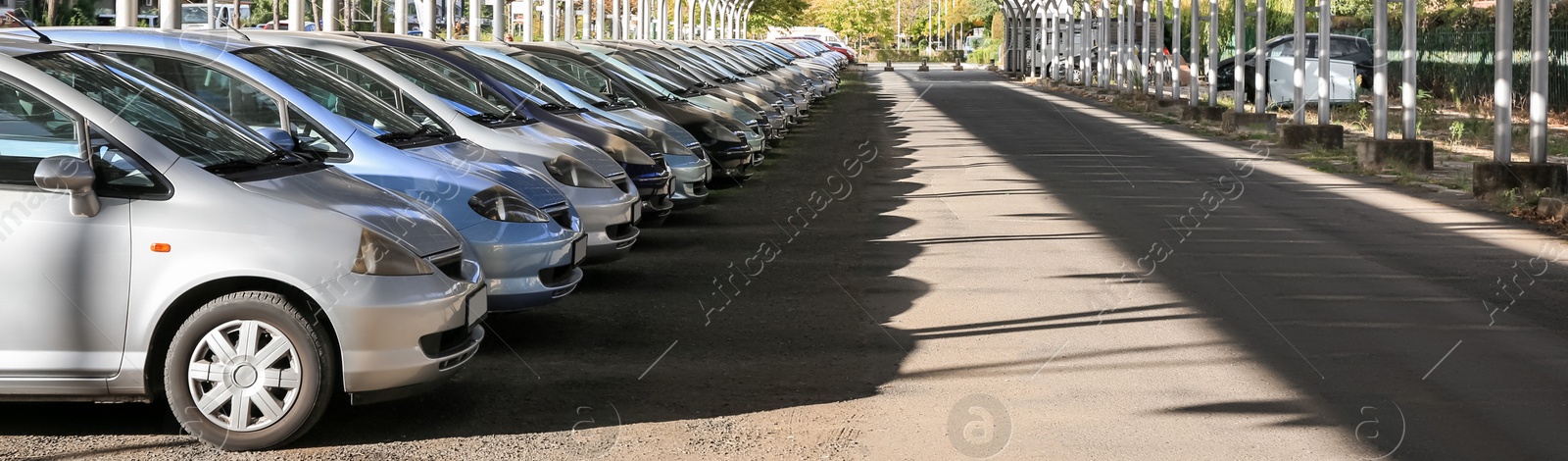 Image of Parking lots with modern cars outdoors, banner design