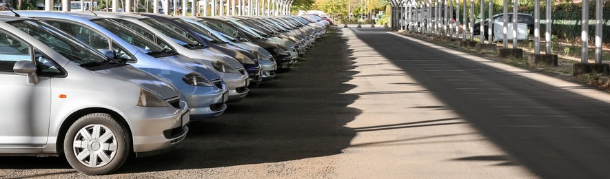 Parking lots with modern cars outdoors, banner design