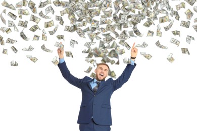 Happy businessman under money rain on white background