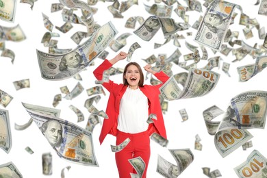 Happy businesswoman under money rain on white background