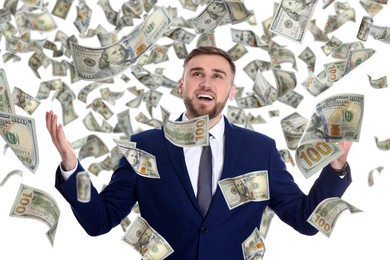 Image of Happy businessman under money rain on white background