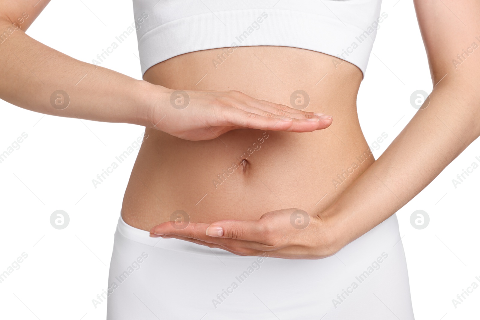 Photo of Healthy digestion. Woman holding something near her belly on white background, closeup