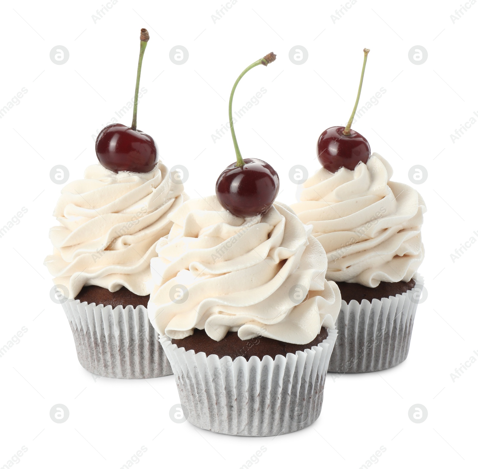 Photo of Delicious cupcakes with cream and cherries isolated on white