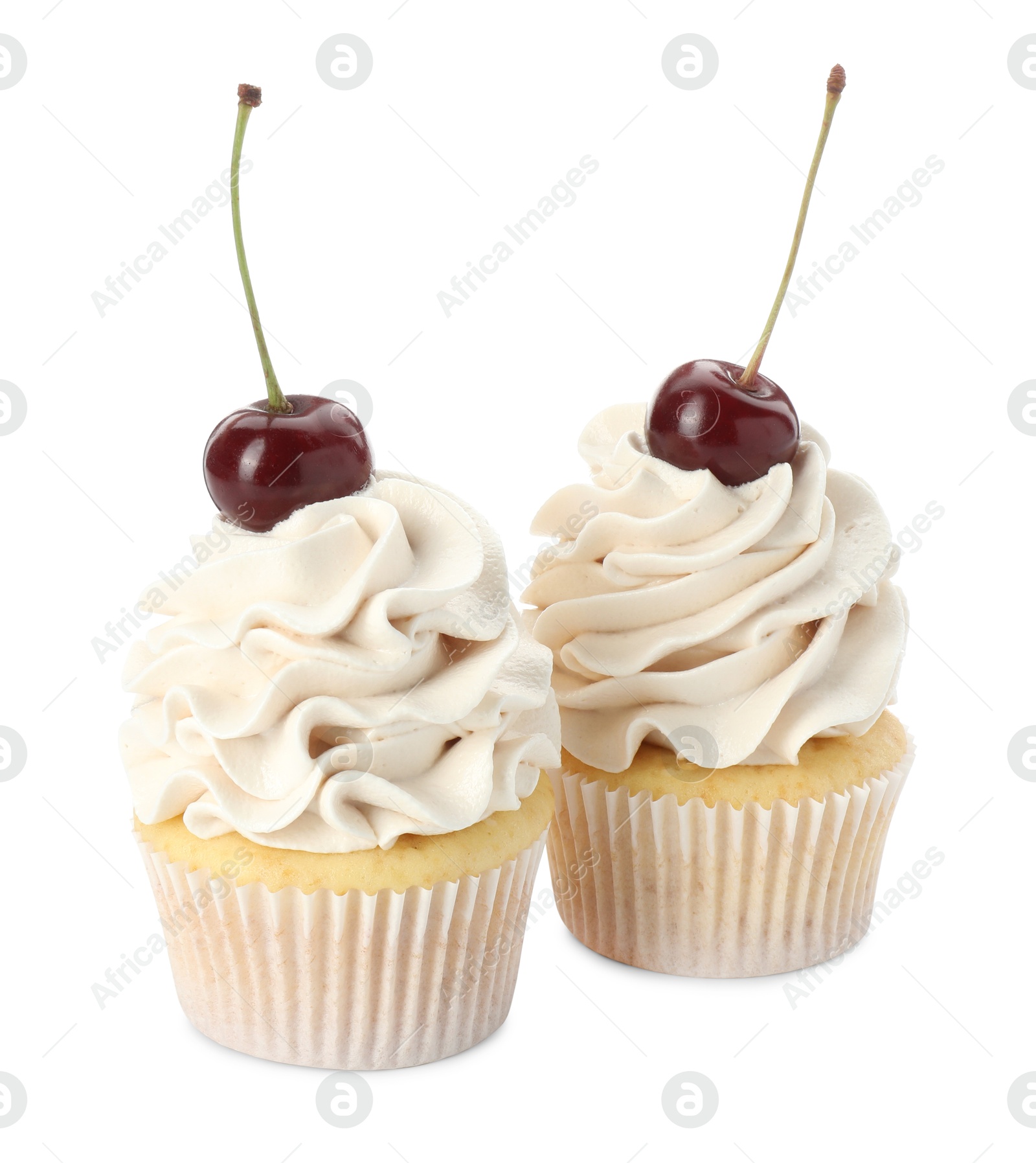 Photo of Delicious cupcakes with cream and cherries isolated on white