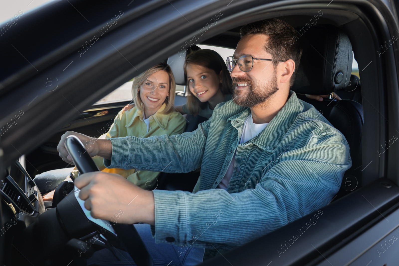 Photo of Happy family enjoying trip together by car, view from outside