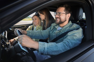 Happy family enjoying trip together by car, view from outside