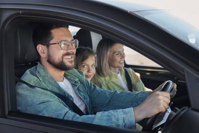 Photo of Happy family enjoying trip together by car, view from outside