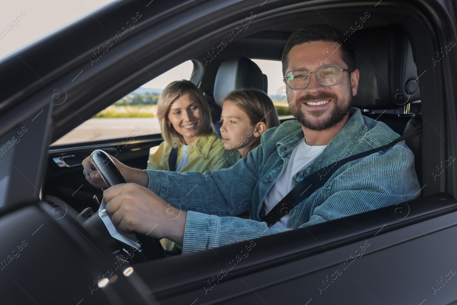 Photo of Happy family enjoying trip together by car, view from outside